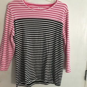 Bright pink, black and white striped shirt.
